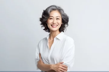 Keuken spatwand met foto Portrait of Asian senior woman posing on white wall background. © Virtual Art Studio