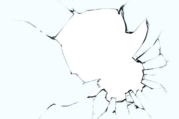 Broken glass with cracks and a big hole. Black cracks on blue glass with a white background