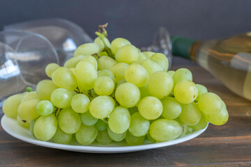 White grapes on dark background for Rtveli Harvest of grapes in Georgia.