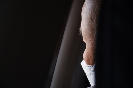 Old Man Is Looking Out Of The Plane Window While Traveling