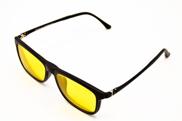 Black plastic frame yellow lens glasses, glasses isolated on white background