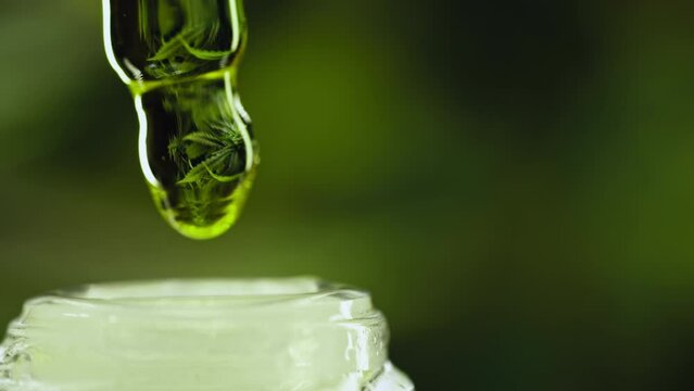 Glass bottle with cannabis THC tincture,herbal treatment.Pharmaceutical hemp oil