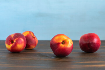 Nectarine on wooden background. Summer food.