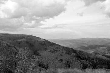 Mountains and hills, rainy clouds black and white background