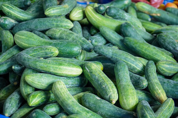 pile of cucumbers sold at a traditional market