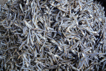 pile of salted fish at traditional market. dry salted fish. selective focus