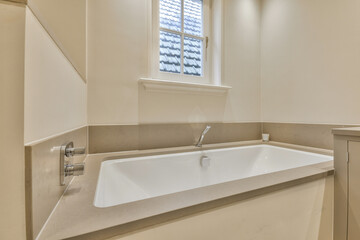 a bathroom with a sink and window in the corner, taken from above to see how it looks like this