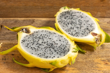 Dragon fruit pitahaya on wooden background.