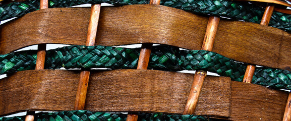 Rattan wicker texture with handmade traditional and dry branches, wicker brown and green texture...