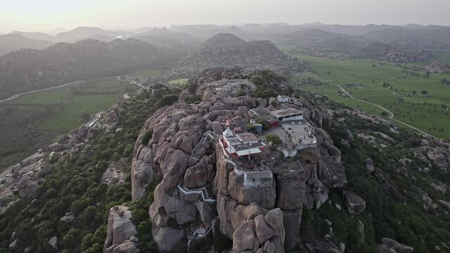 Aerial view: Hindu temple on Anjanadri Hill amidst rocky mountains and natures lap