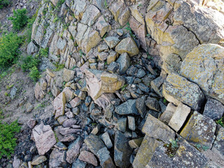 Sheer stone rock, aerial view. Boulders from a bird's eye view.