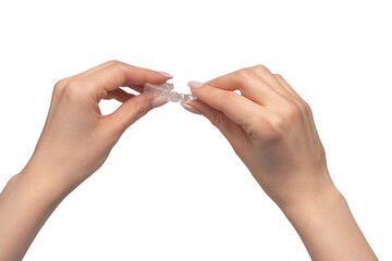 Transparent mouth guard in a woman's hand isolated. - obrazy, fototapety, plakaty