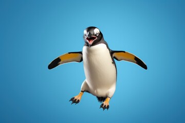 Happy penguin jumping and having fun.