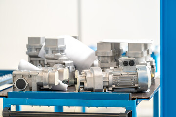 electric motor parts on metal table in workshop