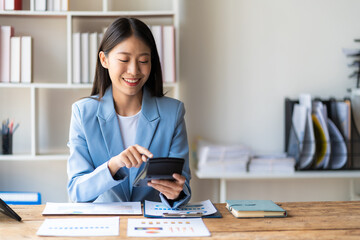 Asian accountants meeting doing accounts payable, assets, capital book value, inventory, liabilities, cost of goods sold. vertical picture