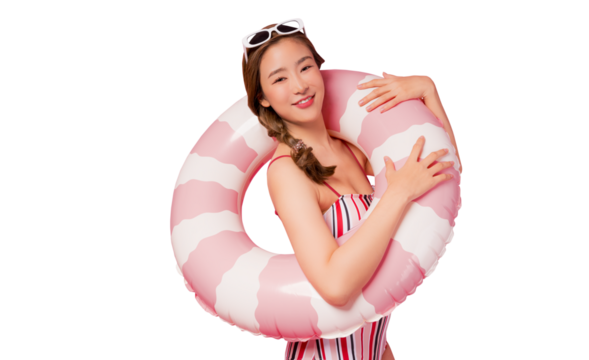 Summer holiday happy young asian woman portrait Happy young woman wear swimsuit hold pink swim ring or inflatable tube ring Lady smile and loook at camera isolated on pink color background studio shot