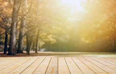 Naklejka na ściany i meble Wood table top on blur autumn park background with sunshine. Perfect for display or montage your products. High quality photo