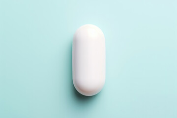 pill on light blue background, top view