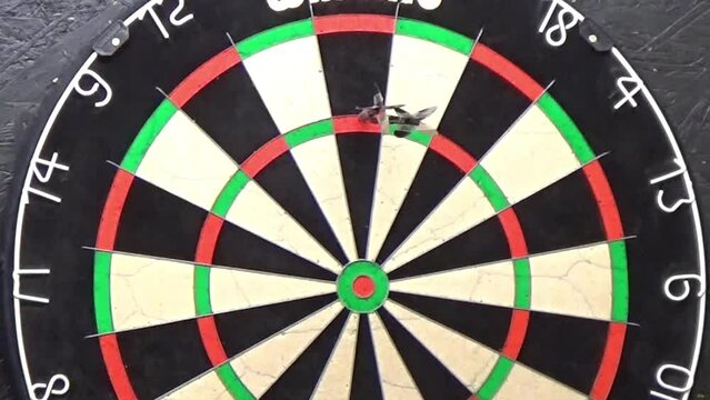 Darts hitting 3 treble 20's and 2 of them fall out