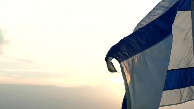 Israel flag with star of David waving against the wind, beautiful sunset outdoor backgrounds. Concept of Israel, Palestine, Iran, Conflict, Gaza, Hamas, War, Freedom, Flag, Independence Day