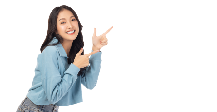Beautiful young Asian woman pointing up to copy space and looking at camera with smile face and happy Pretty girl act like a satisfied product, use for advertising with isolated on white background - Powered by Adobe
