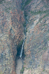 Waterfall in the Valley of the river of Chulyshman. Altai mountains, Russia, beautiful summer day