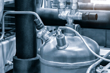 Modern industrial refrigeration equipment. Steel tanks and pipes, Compressor refrigeration station...