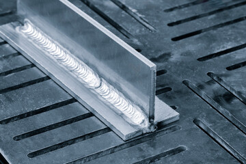 welding seam onto steel metal Industrial steel welder in factory - Powered by Adobe