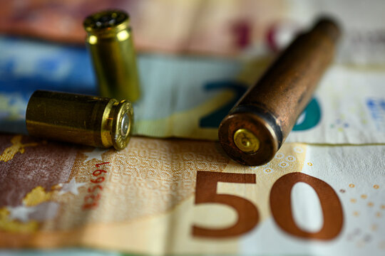 Bullet casings on euro bank notes. High quality photo
