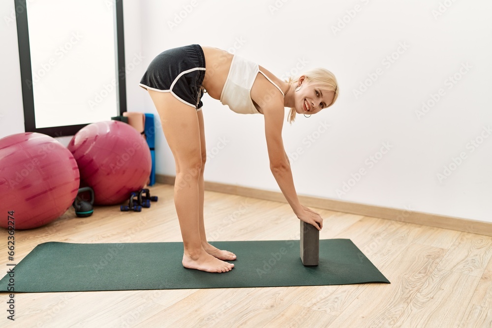 Canvas Prints Young blonde woman smiling confident training yoga exercise at sport center