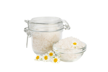 Spa sea salt isolated on white background. Sea salt with chamomile extract in a glass jar on a white background.