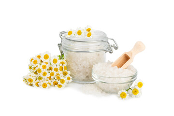 Spa sea salt isolated on white background. Sea salt with chamomile extract in a glass jar on a white background.