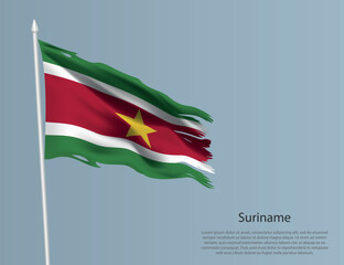Ragged national flag Suriname. Wavy torn fabric on blue background.