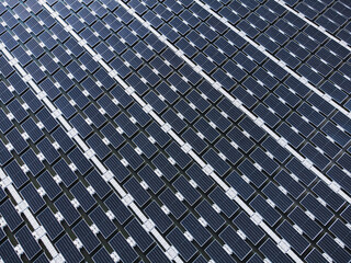 Solar power plant farm on beautiful lake. Floating solar panels providing green energy. Renewable energy.