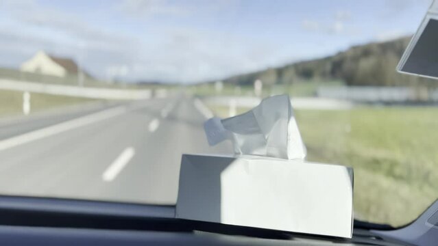 Travel Essentials, Tissue Box on Car Dashboard During Highway Journey, Passenger View