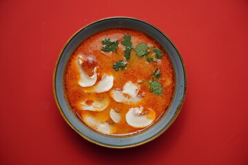 tom yum with rice and mushrooms, spicy soup, asian food