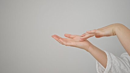 Young beautiful hispanic woman wearing bathrobe touching hand over isolated white background