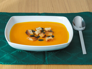 Pumpkin soup with croutons and pumpkin seeds