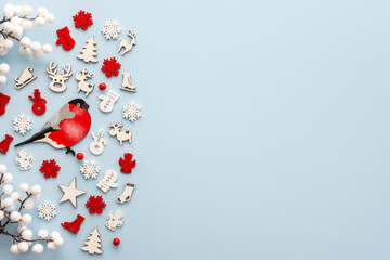 White and red Christmas toys on a blue background, Merry Christmas and Happy New Year concept, top view, copy space