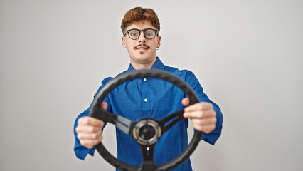 Fototapeta na wymiar Young hispanic man using steering wheel as a driver over isolated white background