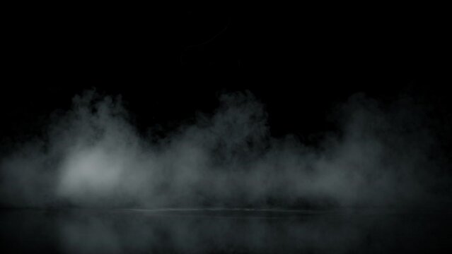 Super Slow Motion Shot of Atmospheric Smoke Slowly Floating on Black Background at 1000fps.