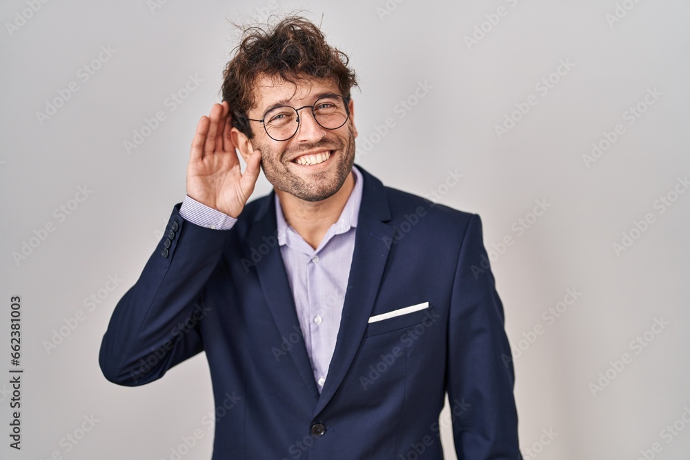 Sticker hispanic business man wearing glasses smiling with hand over ear listening an hearing to rumor or go