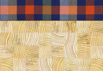 Fototapeta premium Colourful plaid napkin on pine wooden floor table or cutting board