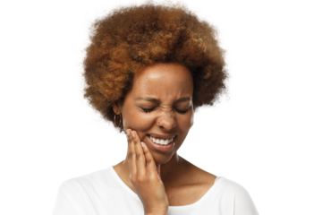 Young african american woman suffering from strong toothache, pressing hand to chin because of jaw pain