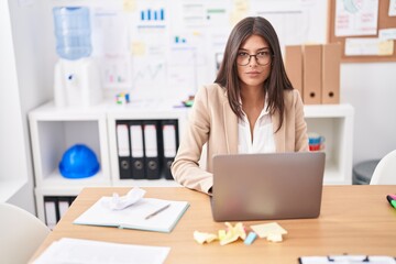 Young beautiful hispanic woman business worker using laptop working at office
