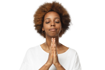 Close-up of young african woman putting hands together, praying with closed eyes to find solution