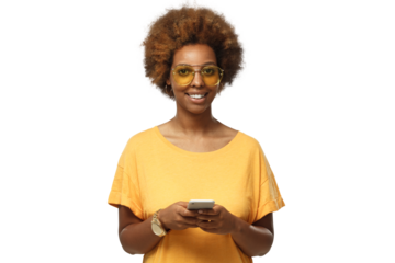 Young african american woman standing in yellow t-shirt, looking at camera, holding the phone