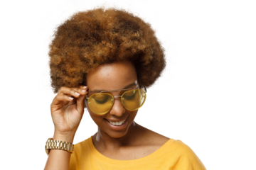 Smiling black woman wearing yellow sunglasses, touching her afro hair
