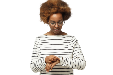 Young african american woman checking smartwatch, wearing wireless earphones and glasses