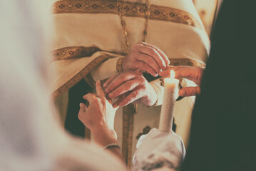Holy wedding sacrament at the orthodox Christian church. Ring exchange ceremony between couples